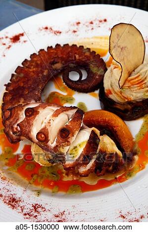 Grilled octopus, El Risco restaurant, Famara, Lanzarote, Canary Islands, Spain View Large Photo Image Stock Image - Grilled octopus, El Risco restaurant, Famara, Lanzarote, Canary Islands, Spain. Fotosearch