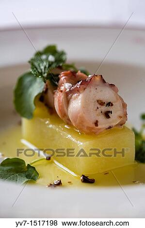 Grilled octopus with candied potatoes, and cinnamon oil Restaurant? Ruta del Veleta? Granada, Andalucia, Spain View Large Photo Image Stock Photo - Grilled octopus with candied potatoes, and cinnamon oil Restaurant? Ruta del Veleta? Granada, Andalucia, Spain. Fotosearch