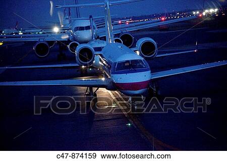 Ground traffic at dusk, JFK airport, New York, USA View Large Photo Image Stock Photo - Ground traffic at dusk, JFK airport, New York, USA. Fotosearch