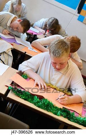 group of 12 year old children, sitting in class, concentrating, drawing View Large Photo Image Stock Photograph - group of 12 year old children, sitting in class, concentrating, drawing. Fotosearch
