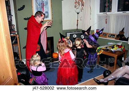 Group of 2-4 year old children dressed up in Halloween fancy dress, at a Halloween party View Large Photo Image Stock Image - Group of 2-4 year old children dressed up in Halloween fancy dress, at a Halloween party. Fotosearch