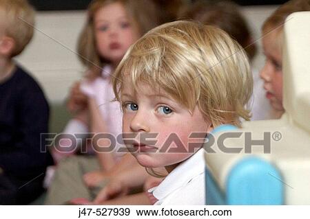 Group of 2-4 year old children sitting in the classroom at nursery View Large Photo Image Stock Photo - Group of 2-4 year old children sitting in the classroom at nursery. Fotosearch