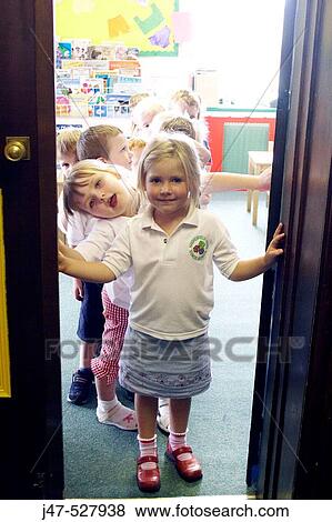 Group of 2-4 year old children standing in the doorway of the classroom at nursery View Large Photo Image Stock Photo - Group of 2-4 year old children standing in the doorway of the classroom at nursery. Fotosearch