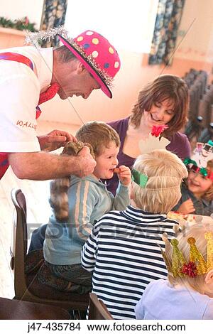 Group of 3 year old children at a party, with a clown View Large Photo Image Picture - Group of 3 year old children at a party, with a clown. Fotosearch
