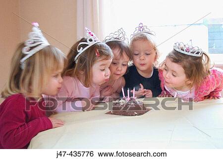 group of 3, year old girls at a party, blowing the candle out on a birthday cake View Large Photo Image Stock Photograph - group of 3, year old girls at a party, blowing the candle out on a birthday cake. Fotosearch