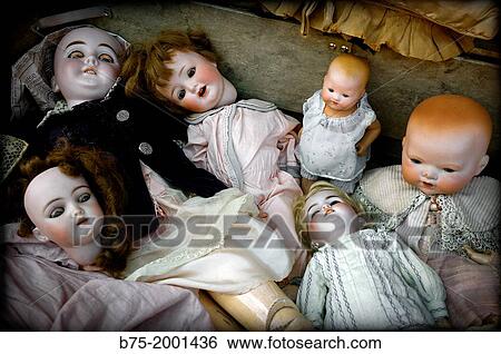 Stock Photograph - group of antique dolls in Puces de Saint-Ouen, antiques market in Paris, France. Fotosearch