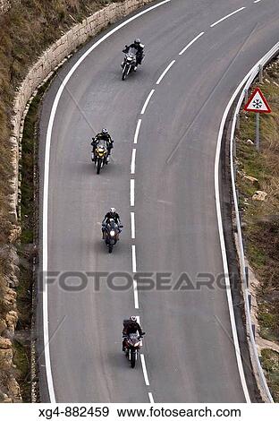 Group of bikers down the road from the Coll de Ares - Ares del Maestre - Maestrat Alt - Castellon - Valencia View Large Photo Image Stock Photo - Group of bikers down the road from the Coll de Ares - Ares del Maestre - Maestrat Alt - Castellon - Valencia. Fotosearch