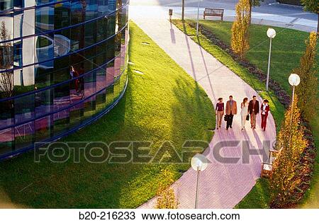 Stock Image - Group of businesspeople walking. Fotosearch