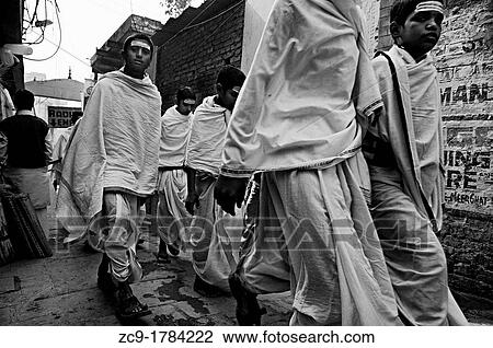 Group of children wearing white tunics pass through an alley Varanasi, India View Large Photo Image Stock Image - Group of children wearing white tunics pass through an alley Varanasi, India. Fotosearch