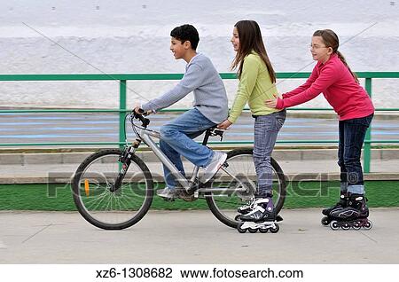 Group of children with bicycle and in-line skates. Spain. View Large Photo Image Stock Image - Group of children with bicycle and in-line skates. Spain.. Fotosearch