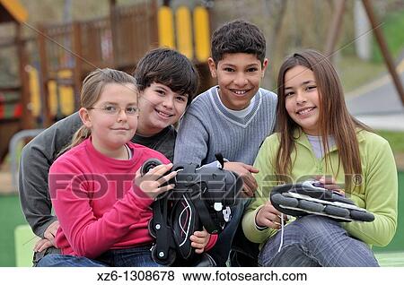 Group of children with skates. Spain. View Large Photo Image Stock Photo - Group of children with skates. Spain.. Fotosearch