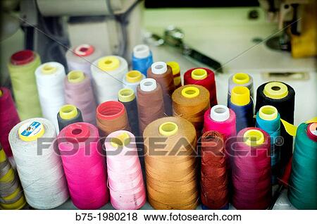 Group of colored thread in a sewing workshop View Large Photo Image Stock Photo - Group of colored thread in a sewing workshop. Fotosearch