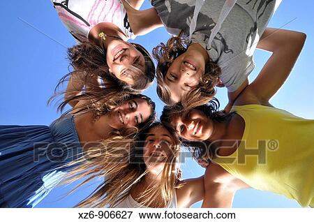 group of five friends embracing, from below View Large Photo Image Stock Photo - group of five friends embracing, from below. Fotosearch