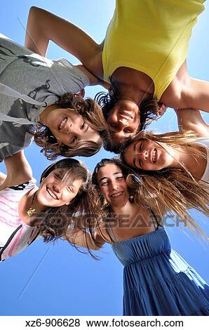 group of five friends embracing, from below View Large Photo Image Stock Photo - group of five friends embracing, from below. Fotosearch