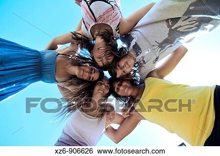 group of five friends embracing, from below View Large Photo Image Stock Photograph - group of five friends embracing, from below. Fotosearch