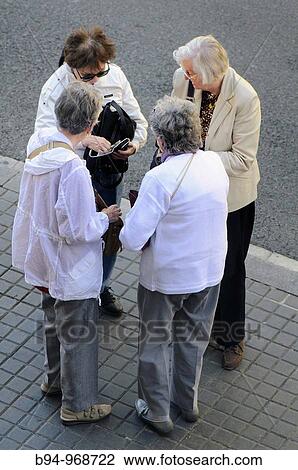 Group of four women on the street. Barcelona, Catalonia, Spain View Large Photo Image Stock Image - Group of four women on the street. Barcelona, Catalonia, Spain. Fotosearch