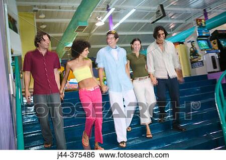 Group of friends in shopping mall View Large Photo Image Stock Photograph - Group of friends in shopping mall. Fotosearch