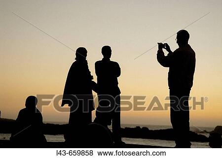 Group of friends taking pictures. Essaouira. Morocco. View Large Photo Image Stock Photo - Group of friends taking pictures. Essaouira. Morocco.. Fotosearch