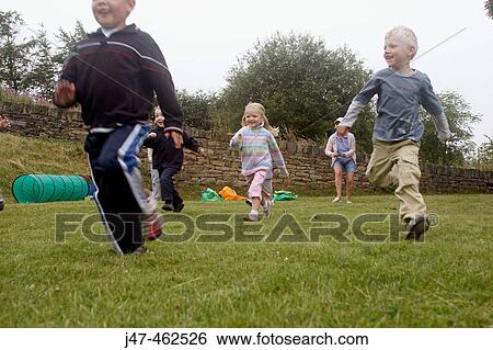 Group of pre school children doing a running race on sports day View Large Photo Image Stock Photograph - Group of pre school children doing a running race on sports day. Fotosearch