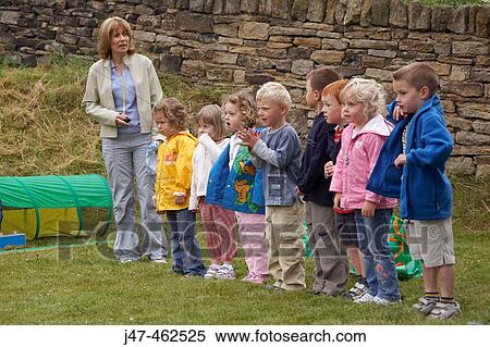 Group of pre school children standing in a line, waiting to start a race on sports day View Large Photo Image Stock Photography - Group of pre school children standing in a line, waiting to start a race on sports day. Fotosearch