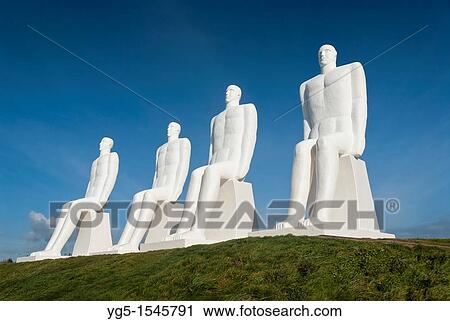 Stock Image - Group of Sculptures - MAN AND SEA - of Svend Wiig Hansen at Esbjerg Harbour, Jutland, Denmark. Fotosearch