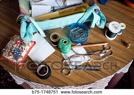 group of sewing utensils on a table, View Large Photo Image Stock Image - group of sewing utensils on a table,. Fotosearch