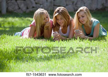 Group of Teenagers on their Blackberry? s View Large Photo Image Stock Image - Group of Teenagers on their Blackberry? s. Fotosearch