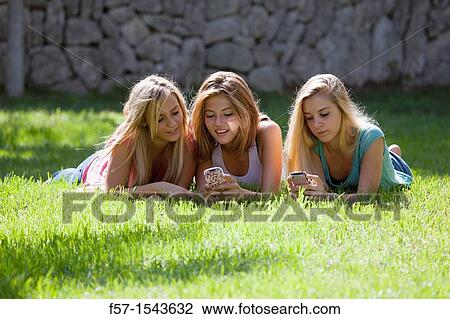 Group of Teenagers on their Blackberry? s View Large Photo Image Stock Image - Group of Teenagers on their Blackberry? s. Fotosearch