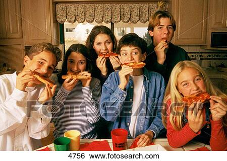 Group of teens eating pizza View Large Photo Image Stock Photograph - Group of teens eating pizza. Fotosearch