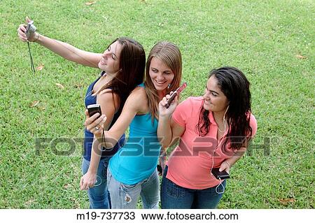 Group of teens taking a picture or themselves View Large Photo Image Stock Image - Group of teens taking a picture or themselves. Fotosearch