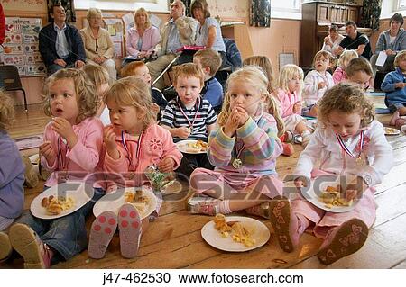 Group of under 4's at nursrey sitting on the floor eating a picnic View Large Photo Image Stock Image - Group of under 4's at nursrey sitting on the floor eating a picnic. Fotosearch