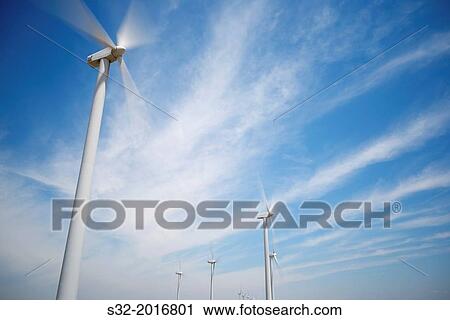 Stock Image - group of windmills for renewable electric energy production.. Fotosearch