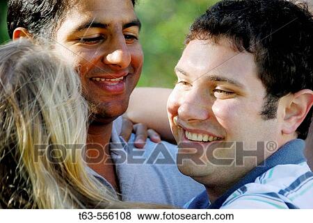 group of young adults embracing together View Large Photo Image Stock Photo - group of young adults embracing together. Fotosearch