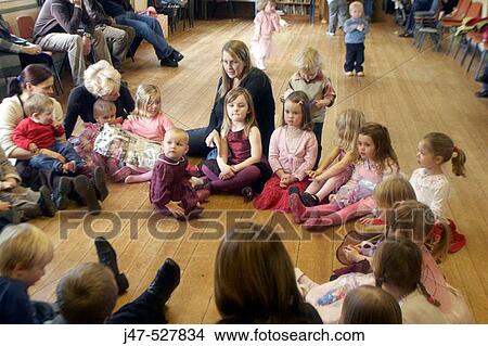 Group of young children at a party, playing pass the parcel View Large Photo Image Picture - Group of young children at a party, playing pass the parcel. Fotosearch