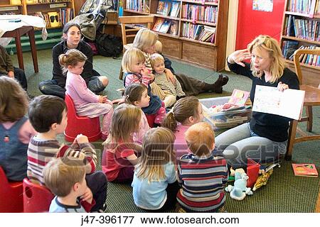 group of young children during story time at the library View Large Photo Image Stock Photo - group of young children during story time at the library. Fotosearch