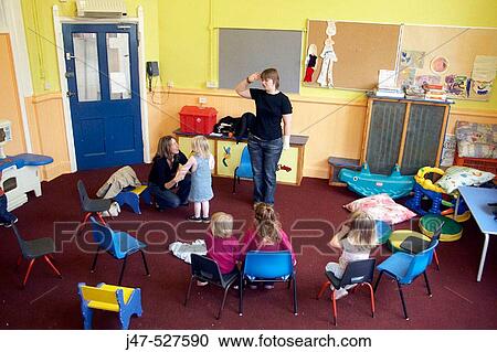 Group of young children playing together in a music class View Large Photo Image Stock Image - Group of young children playing together in a music class. Fotosearch