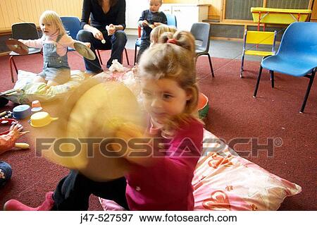 Group of young children playing together in a music class View Large Photo Image Stock Photo - Group of young children playing together in a music class. Fotosearch