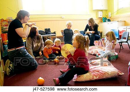 Group of young children playing together in a music class View Large Photo Image Stock Photo - Group of young children playing together in a music class. Fotosearch