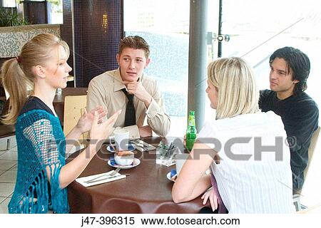 Group of young people, having a chat in a caf? View Large Photo Image Stock Photography - Group of young people, having a chat in a caf?. Fotosearch