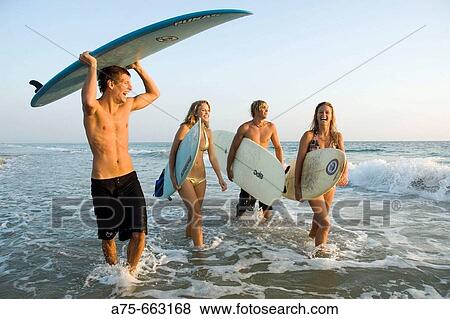group of young surfers View Large Photo Image Stock Photo - group of young surfers. Fotosearch