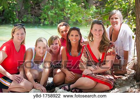 Group portrait of seven women, all 45 years old caucasian, at the Frio River in Texas, USA View Large Photo Image Stock Image - Group portrait of seven women, all 45 years old caucasian, at the Frio River in Texas, USA. Fotosearch