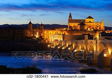 Stock Image - Guadalquivir river, Roman bridge and mosque-cathedral at Dusk C? rdoba Andalusia Spain.. Fotosearch