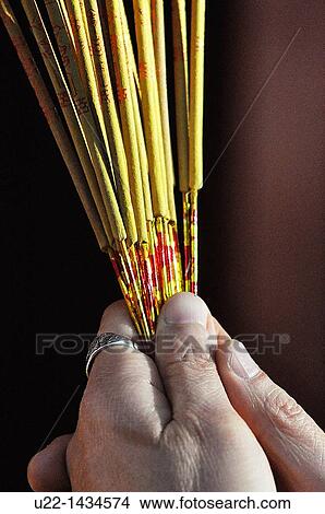 Guangzhou (China): a woman burning incense at the Guangxiao Temple View Large Photo Image Picture - Guangzhou (China): a woman burning incense at the Guangxiao Temple. Fotosearch