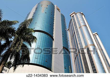 Stock Image - Guangzhou (China): the City Development Plaza building and another skyscraper in Tianhe. Fotosearch