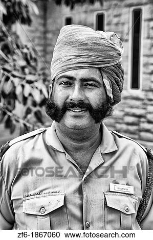 Guard at entrance to the historic Umaid Bhawan Palace in Jodhpur Rajasthan India which is now mostly a hotel where visitors and Raj with Queen now live View Large Photo Image Stock Image - Guard at entrance to the historic Umaid Bhawan Palace in Jodhpur Rajasthan India which is now mostly a hotel where visitors and Raj with Queen now live. Fotosearch