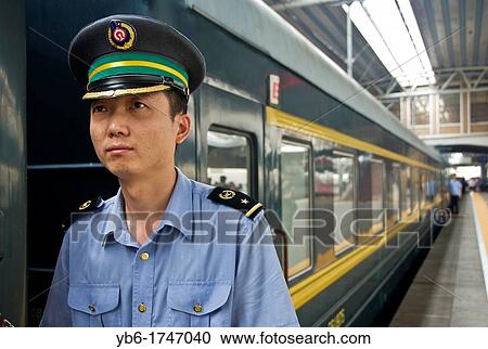 Guard waiting for the Trans-Mongolian depart at the Beijing Train Station, China. View Large Photo Image Stock Image - Guard waiting for the Trans-Mongolian depart at the Beijing Train Station, China.. Fotosearch