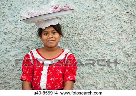 Guatemala, Antigua, girl selling candied fruit View Large Photo Image Picture - Guatemala, Antigua, girl selling candied fruit. Fotosearch