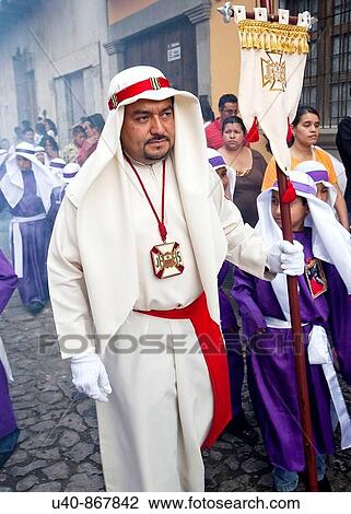 Stock Image - Guatemala, Antigua, Holy week, Man in procession (MR). Fotosearch