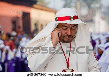Guatemala, Antigua, Holy week, Man on cellphone View Large Photo Image Stock Image - Guatemala, Antigua, Holy week, Man on cellphone. Fotosearch