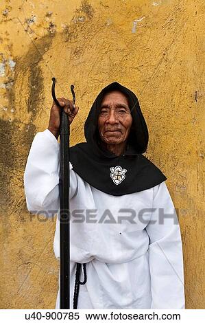 Stock Photography - Guatemala, Antigua, Man dressed for holy week procession (MR). Fotosearch